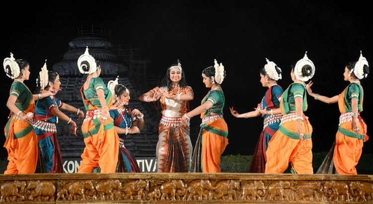 Classical dancers performing at Konark Dance Festival in front of Sun Temple